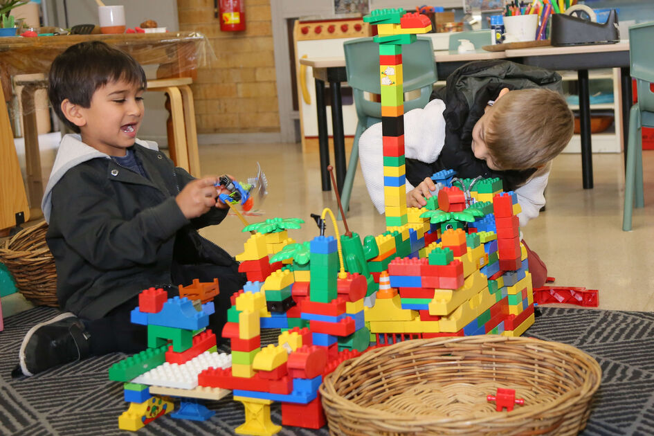 Boys playing with Duplo