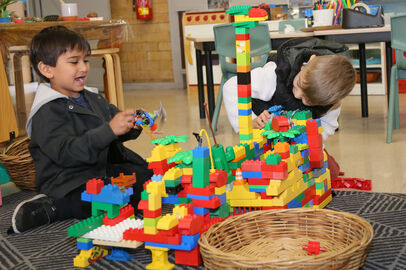 Boys playing with Duplo