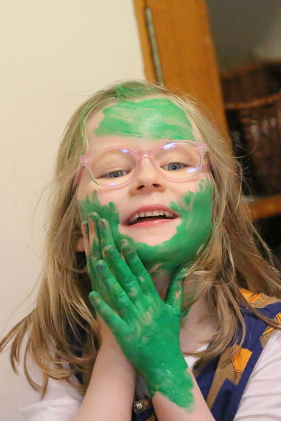 Girl headshot covered in paint