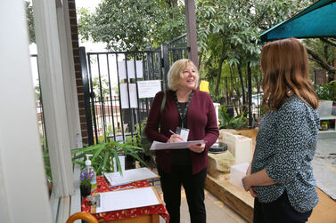 Heather and Emma talking at entry