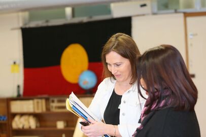 Mika and educator with Aboriginal flag